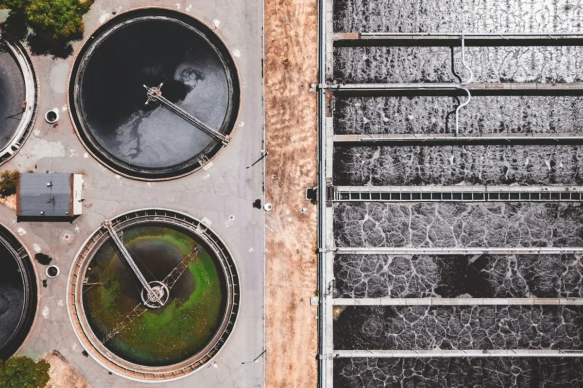Aerial view of circular water treatment tanks and connecting infrastructure